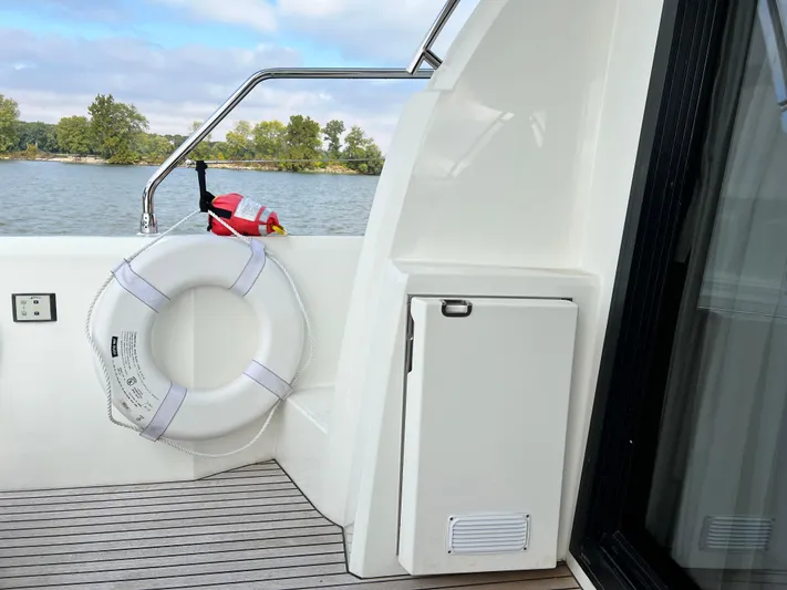  Yacht Photos Pics 2018 Prestige 460 yacht deck with life preserver and scenic water view.