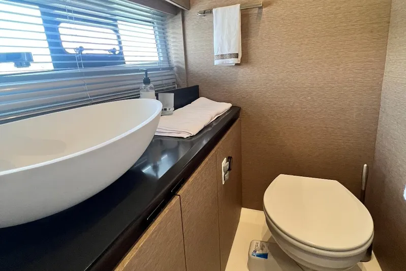  Yacht Photos Pics Luxurious bathroom in 2018 Prestige 460 yacht with modern sink and toilet.