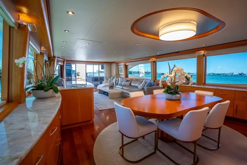 Serenity Yacht Photos Pics Luxurious interior of a 2008 Lazzara Motor Yacht with elegant dining and seating areas.