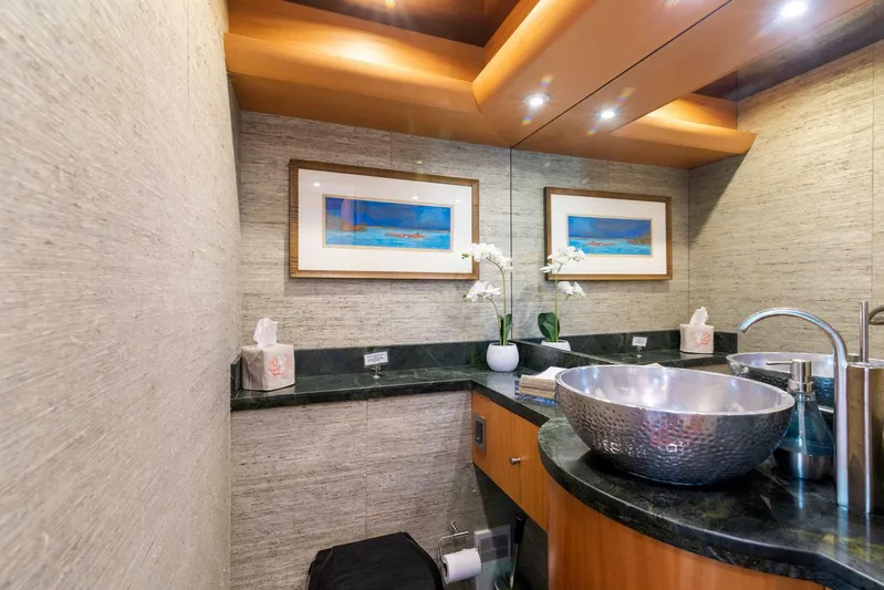 Serenity Yacht Photos Pics Luxurious bathroom on a 2008 Lazzara Motor Yacht with modern sink and elegant decor.