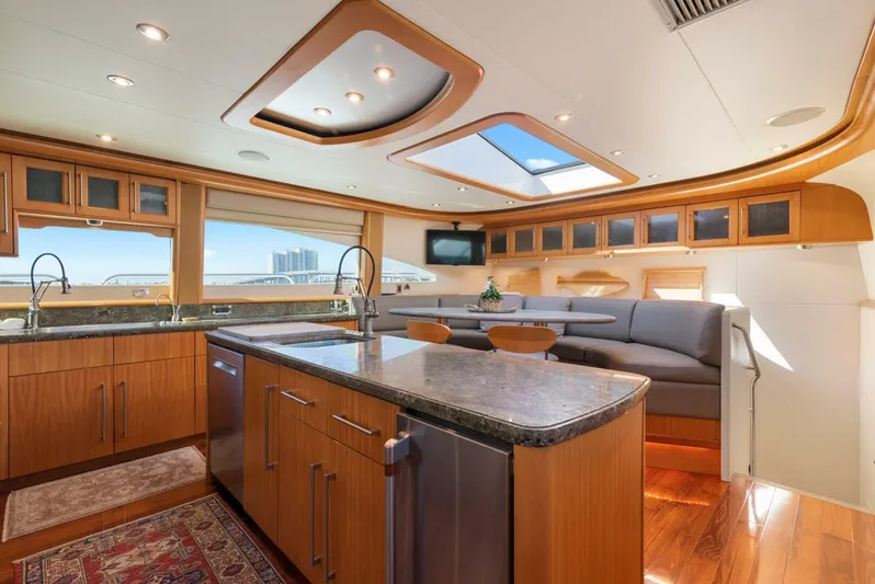 Serenity Yacht Photos Pics Luxurious interior of a 2008 Lazzara Motor Yacht with modern kitchen and seating area.