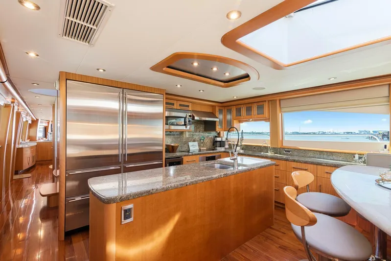 Serenity Yacht Photos Pics Luxurious kitchen interior of 2008 Lazzara Motor Yacht with modern appliances and ocean view.