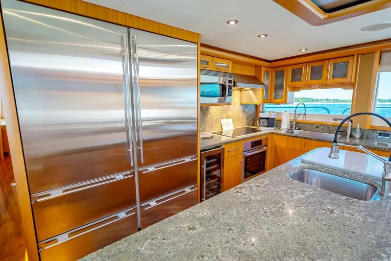 Serenity Yacht Photos Pics Luxurious kitchen in a 2008 Lazzara Motor Yacht with stainless steel appliances.