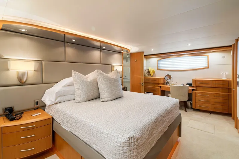 Serenity Yacht Photos Pics Luxurious bedroom in a 2008 Lazzara Motor Yacht with modern furnishings.