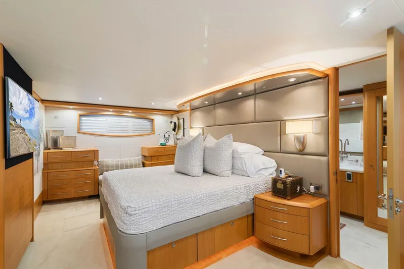 Serenity Yacht Photos Pics Luxurious bedroom in a 2008 Lazzara Motor Yacht with modern furnishings.