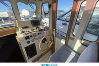 Interior view of 2008 Rhea RHEA 800 boat cockpit with steering wheel and controls.