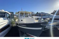 2008 Rhea RHEA 800 boat displayed at RCMarine Occasions under clear blue sky.