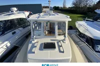 Rhea 800 boat from 2008, docked among other vessels at RCMarine Occasions.
