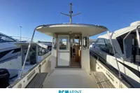 2008 Rhea RHEA 800 boat docked, showcasing cabin entrance and sleek design.