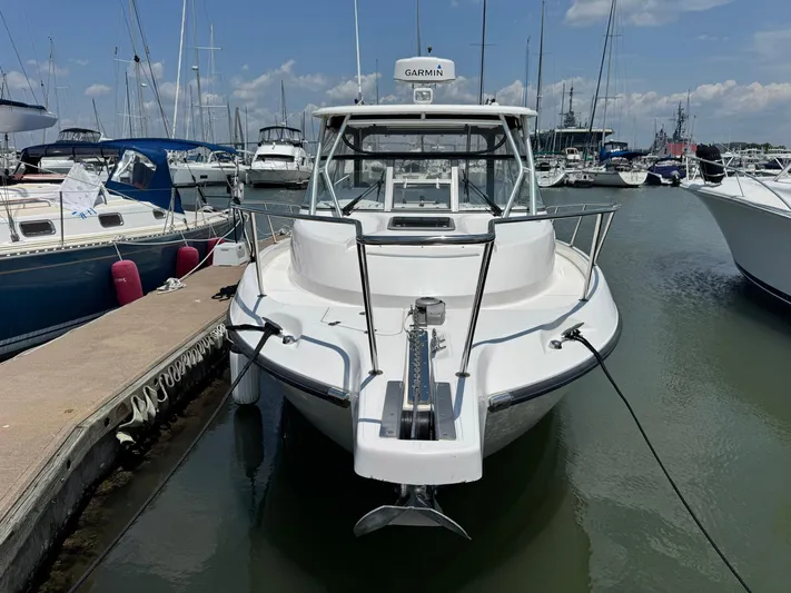 Bilboat Baggins Yacht Photos Pics 2011 Boston Whaler 305 Conquest docked at marina, front view.