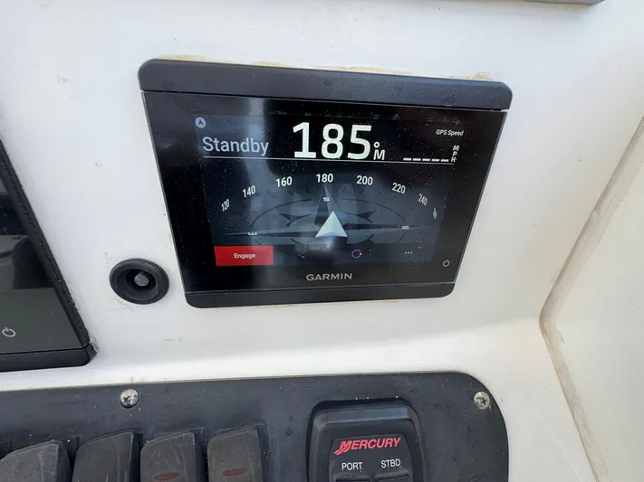 Bilboat Baggins Yacht Photos Pics Garmin navigation display on 2011 Boston Whaler 305 Conquest boat dashboard.