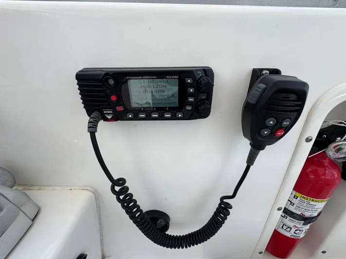 Bilboat Baggins Yacht Photos Pics VHF radio and fire extinguisher on 2011 Boston Whaler 305 Conquest boat.