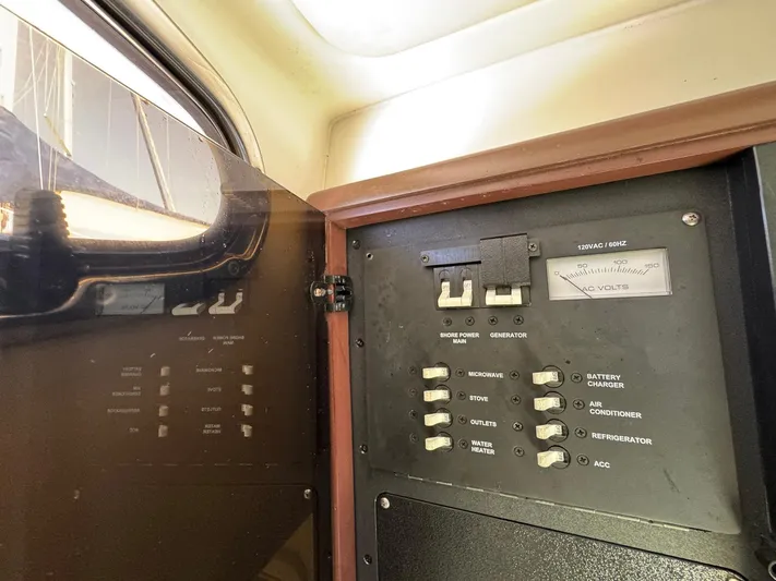 Bilboat Baggins Yacht Photos Pics Electrical panel inside 2011 Boston Whaler 305 Conquest boat cabin.