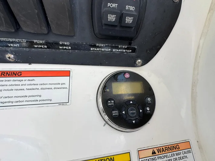 Bilboat Baggins Yacht Photos Pics Control panel of a 2011 Boston Whaler 305 Conquest boat with warning labels.