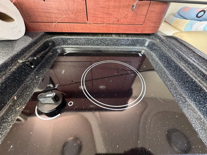 Bilboat Baggins Yacht Photos Pics Stovetop on 2011 Boston Whaler 305 Conquest boat, featuring sleek black design.