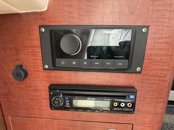 Bilboat Baggins Yacht Photos Pics Control panel on 2011 Boston Whaler 305 Conquest boat with audio system.