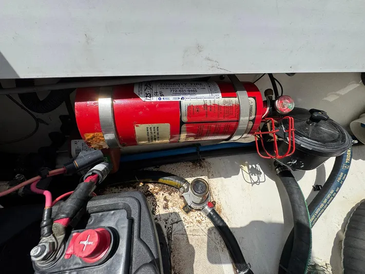 Bilboat Baggins Yacht Photos Pics Engine compartment of a 2011 Boston Whaler 305 Conquest with fire extinguisher and wiring.