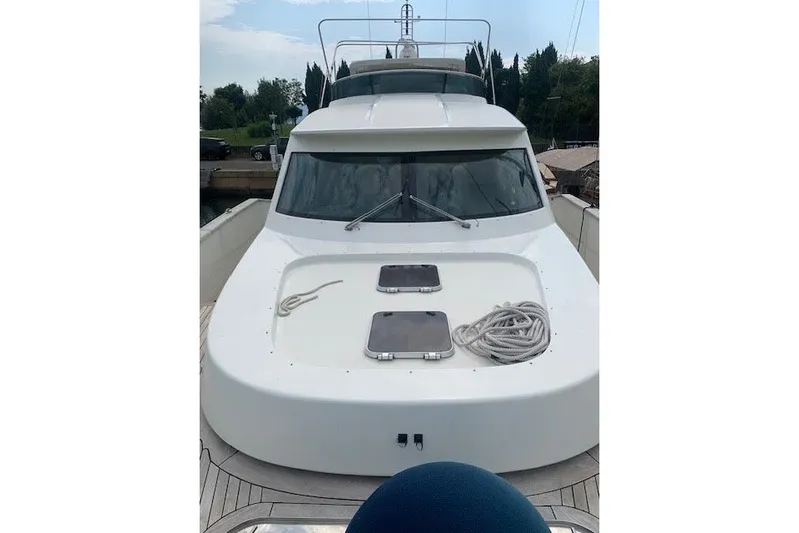  Yacht Photos Pics Luxury 2012 Huzur Yachts 78, sleek design, docked with coiled rope on deck.