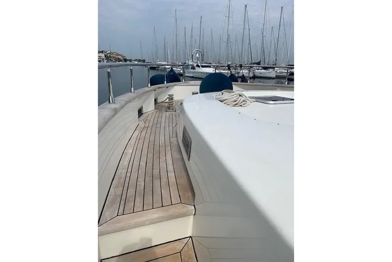  Yacht Photos Pics Luxury Huzur Yachts 78, 2012 model, docked with wooden deck and marina view.