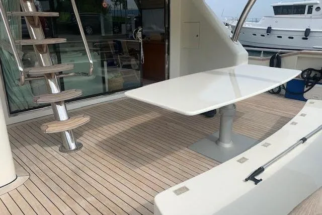 Yacht Photos Pics Luxury Huzur Yachts 78, 2012 model, featuring elegant deck with table and spiral staircase.
