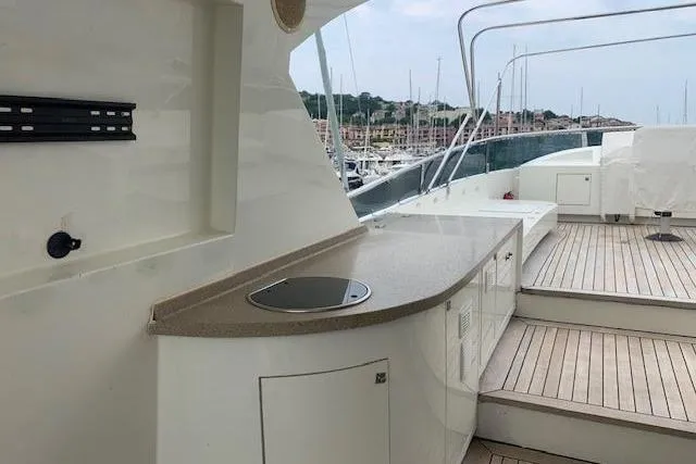  Yacht Photos Pics Luxurious 2012 Huzur Yachts 78 with spacious deck and modern amenities in marina setting.