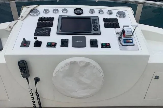  Yacht Photos Pics Control panel of a 2012 Huzur Yachts 78, featuring navigation and communication equipment.