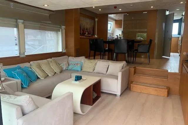  Yacht Photos Pics Luxurious interior of 2012 Huzur Yachts 78 with modern seating and dining area.