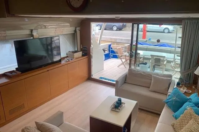  Yacht Photos Pics Luxurious interior of 2012 Huzur Yachts 78, featuring modern furnishings and large windows.