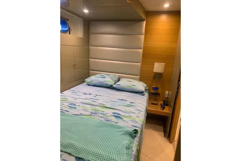  Yacht Photos Pics Luxurious bedroom interior on 2012 Huzur Yachts 78, featuring modern design and cozy bedding.