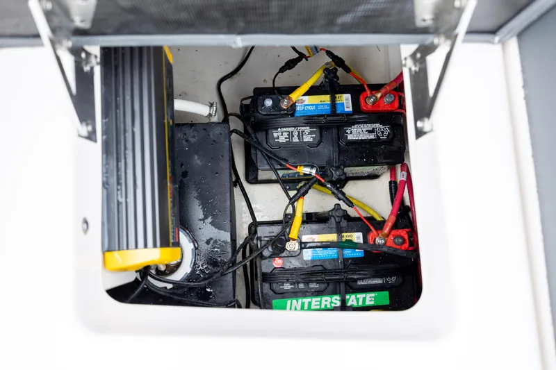  Yacht Photos Pics Battery compartment of 2023 Chaparral 280 OSX boat with Interstate batteries and wiring.