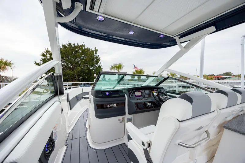  Yacht Photos Pics 2023 Chaparral 280 OSX boat interior with modern dashboard and seating.
