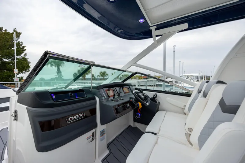  Yacht Photos Pics 2023 Chaparral 280 OSX boat interior with modern dashboard and seating.