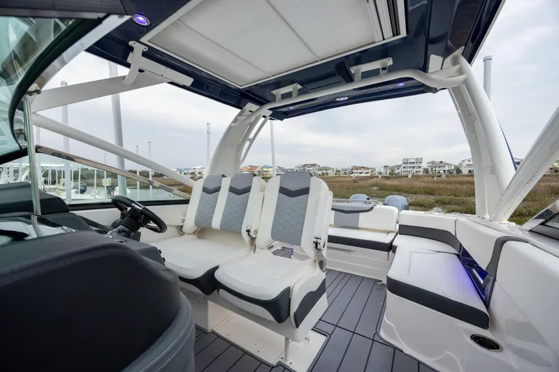  Yacht Photos Pics 2023 Chaparral 280 OSX boat interior with modern seating and sleek design.