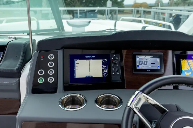  Yacht Photos Pics Dashboard of 2023 Chaparral 280 OSX boat with navigation screens and controls.