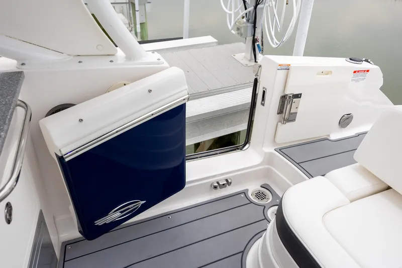  Yacht Photos Pics 2023 Chaparral 280 OSX boat interior with seating and access door.