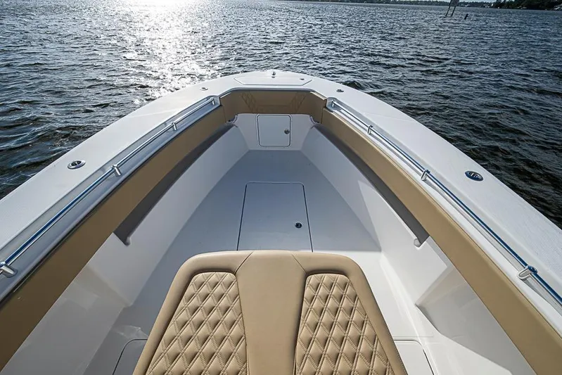 Rippleffect Yacht Photos Pics 2023 Invincible 33 Open Fisherman boat, spacious deck, luxurious seating, on calm waters.