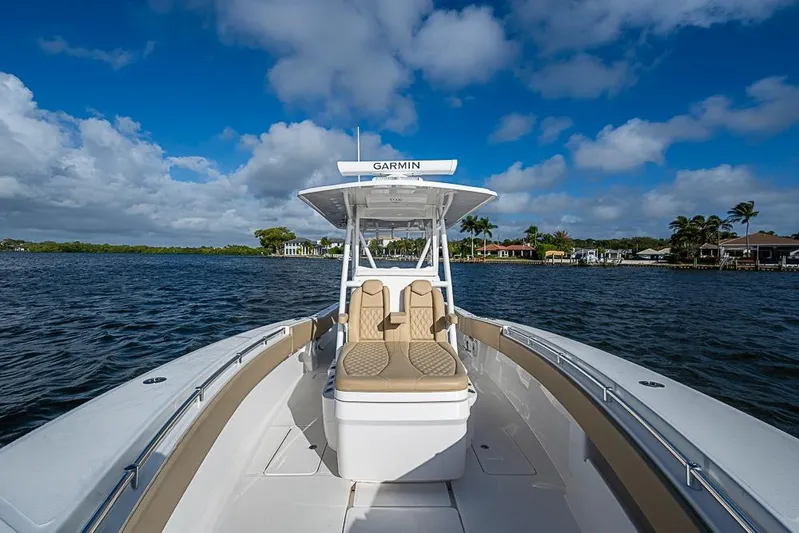 Rippleffect Yacht Photos Pics 2023 Invincible 33 Open Fisherman boat on a sunny day, featuring Garmin equipment.
