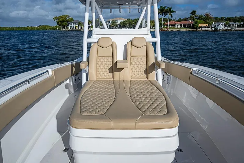 Rippleffect Yacht Photos Pics 2023 Invincible 33 Open Fisherman boat interior with luxurious seating on the water.