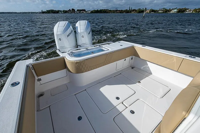 Rippleffect Yacht Photos Pics 2023 Invincible 33 Open Fisherman boat with twin Mercury engines on the water.