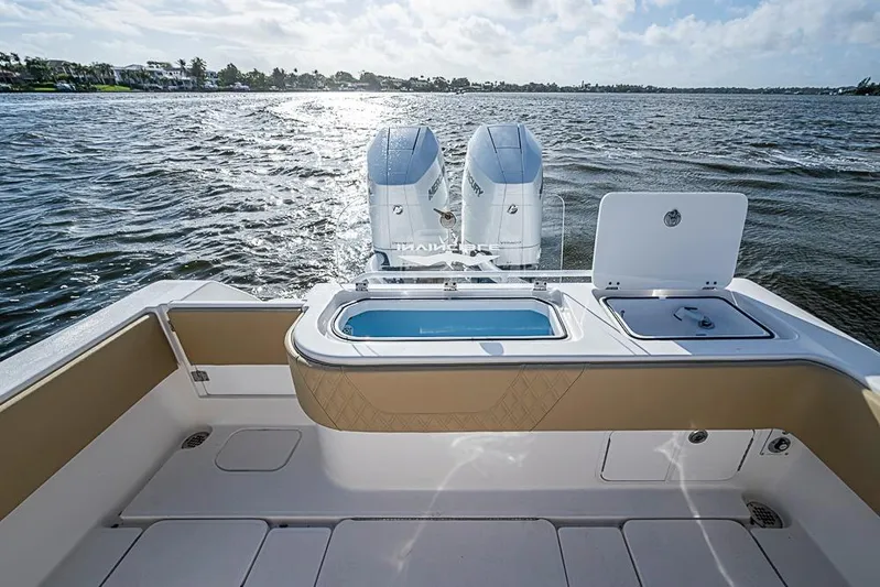 Rippleffect Yacht Photos Pics 2023 Invincible 33 Open Fisherman boat with dual engines on open water.