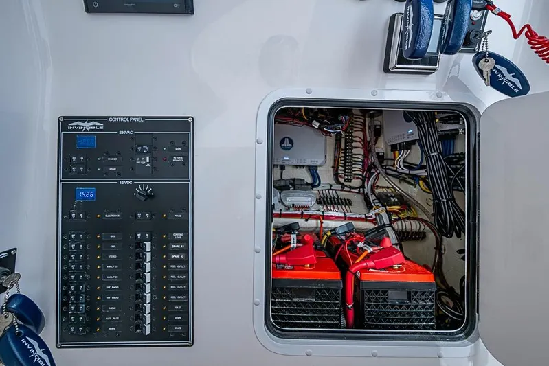 Rippleffect Yacht Photos Pics Control panel and wiring inside 2023 Invincible 33 Open Fisherman boat.
