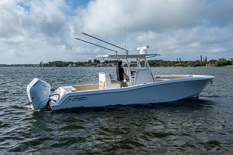 Rippleffect Yacht Photos Pics 2023 Invincible 33 Open Fisherman boat on water, featuring sleek design and powerful engine.