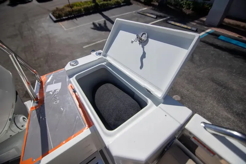 Yacht Photos Pics Open storage compartment on 2025 Quarken 35 Cabin boat, featuring a secure lock mechanism.
