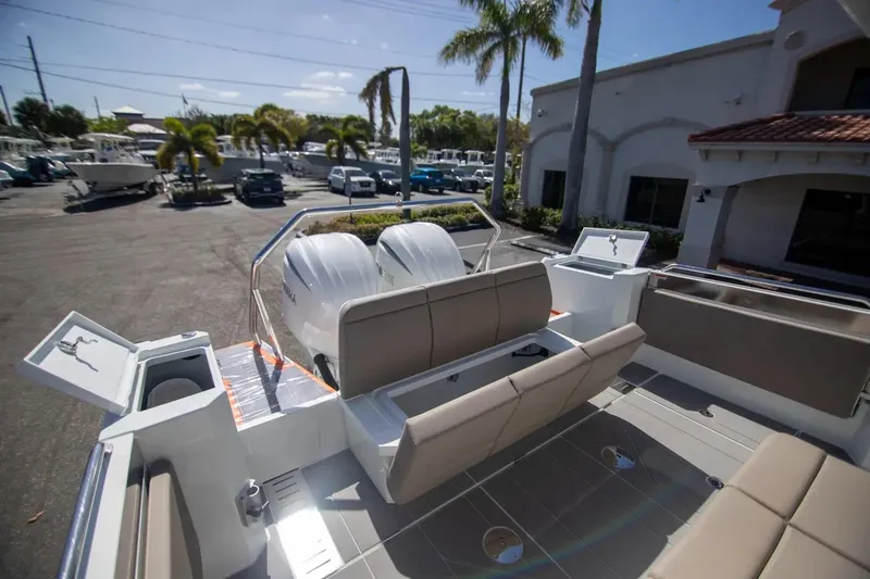  Yacht Photos Pics 2025 Quarken 35 Cabin boat with spacious seating and modern design in a sunny marina setting.