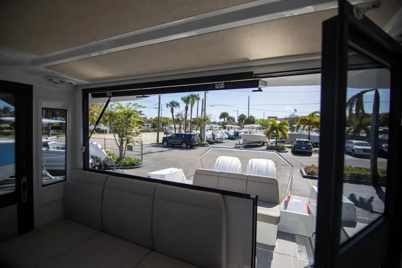  Yacht Photos Pics Interior view of 2025 Quarken 35 Cabin boat with open window and outdoor scenery.