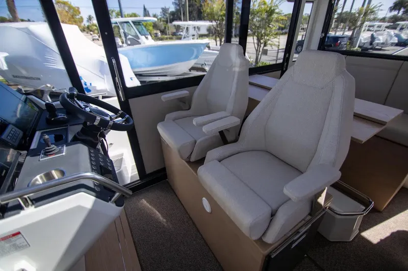  Yacht Photos Pics 2025 Quarken 35 Cabin interior with modern seating and control panel.