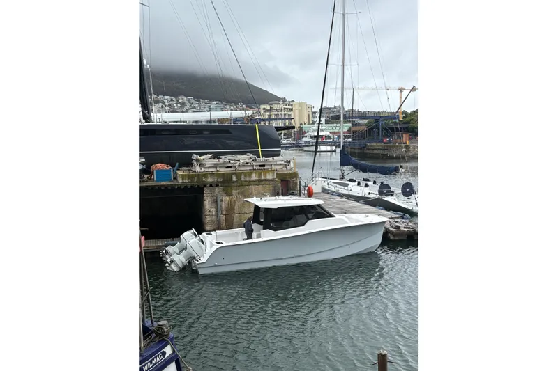 Hammercat 35hh Yacht Photos Pics 2026 Hammer Yachts 35HH docked in a marina with overcast skies.