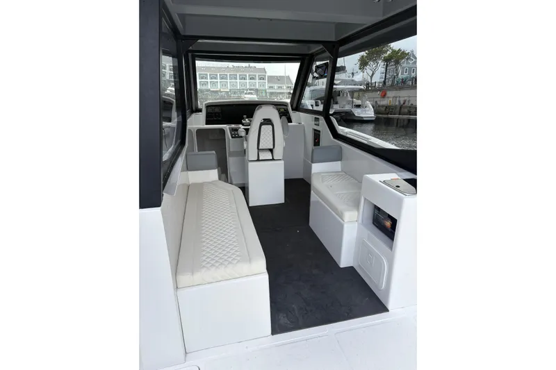 Hammercat 35hh Yacht Photos Pics Interior of 2026 Hammer Yachts 35HH, featuring modern seating and helm, dockside view.