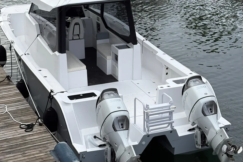 Hammercat 35hh Yacht Photos Pics 2026 Hammer Yachts 35HH boat with dual engines docked at a marina.