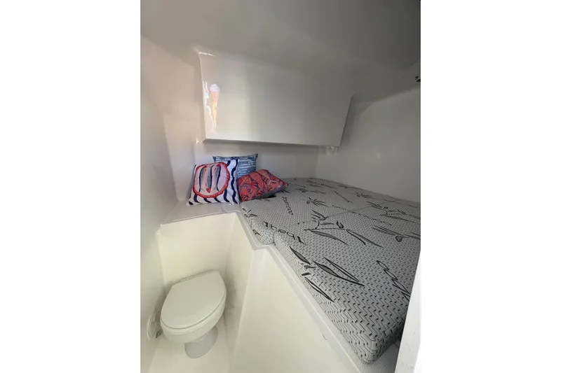 Hammercat 35hh Yacht Photos Pics Compact cabin interior of 2026 Hammer Yachts 35HH with bed and toilet.